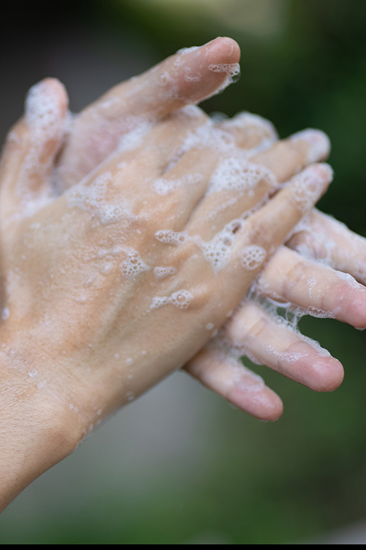 person-washing-hands-with-soap